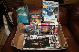 A TRAY OF STAR WARS RELATED ITEMS TO INCLUDE BOARD GAMES, POP UP BOOK ETC.