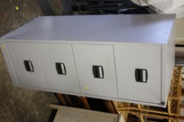 A FOUR DRAWER METAL FILING CABINET
