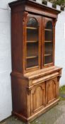 A VICTORIAN MAHOGANY GLAZED FLOORSTANDING BOOKCASE, the twin glazed door upper section with