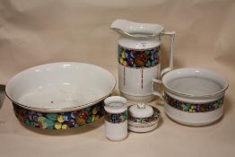 A FIVE PIECE CERAMIC JUG AND BOWL SET