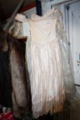 A WEDDING DRESS WITH VEIL, HEADDRESS AND SHOES
