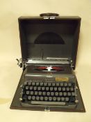A CASED VINTAGE IMPERIAL TYPEWRITER