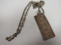 A HALLMARKED SILVER INGOT ON CHAIN