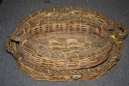 TWO WICKER ROPE HANDLED OVAL LOG BASKETS, LARGEST WIDTH, 66 CM