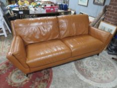 A MODERN TAN LEATHER 3 SEATER W-216 CM