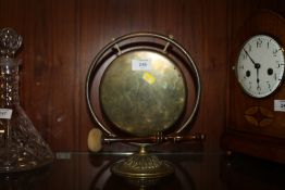 A BRASS TABLE GONG