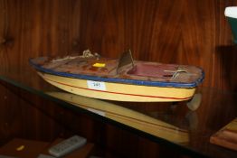 A VINTAGE HAND BUILT WIND UP MODEL BOAT, LENGTH 40 CM