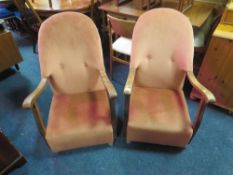 A PAIR OF VINTAGE OAK FRAMED UPHOLSTERED ARMCHAIRS