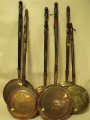 A COLLECTION OF SIX COPPER AND BRASS WARMING PANS
