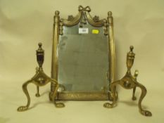 A MODERN BRASS EFFECT MIRROR AND A PAIR OF BRASS FIRE DOGS