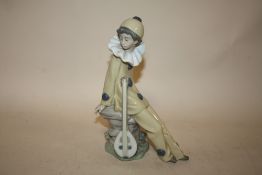 A NAO FIGURE OF A YOUNG MAN WITH A LUTE