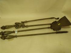 A SET OF ANTIQUE BRASS FIRE IRONS