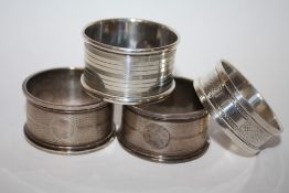FOUR HALLMARKED SILVER NAPKIN RINGS