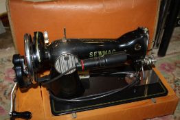 A CASED VINTAGE SEWMAC DELUX SEWING MACHINE