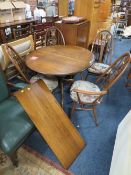 AN ERCOL EXTENDING TABLE WITH FOUR SWAN BACK CHAIRS ( 3+1 )