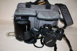 A NIKON FE2 CAMERA TOGETHER WITH TAMRON LENSES, ETC. IN CARRY CASE