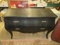 A MODERN FAUX LEATHER BOMBE SHAPED TWO DRAWER CHEST H-84 W-122 CM