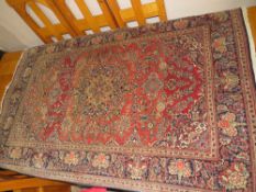 AN EASTERN STYLE EARLY 20TH CENTURY WOOLLEN RUG 210 X 128 CM A/F