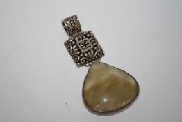 A LARGE STERLING SILVER POLISHED STONE PENDANT