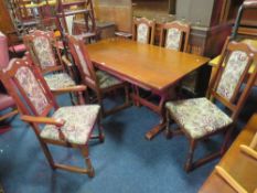 AN 'OLD CHARM' OAK DINING TABLE AND 6 CHAIRS