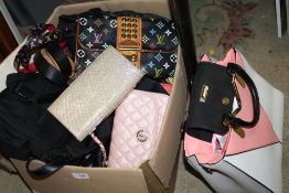 A BOX OF LADIES DESIGNER STYLE HANDBAGS