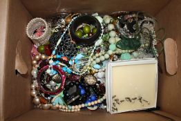 A LARGE BOX OF COSTUME JEWELLERY