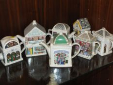 A COLLECTION OF WADE NOVELTY TEAPOTS