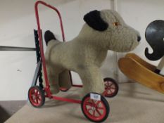 A CHILD'S PUSH ALONG DOG TOY