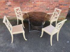 A MODERN GLASS CIRCULAR DINING TABLE DIA.117 CM WITH 4 PAINTED CHAIRS