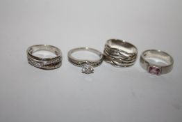 FOUR STERLING SILVER LADIES DRESS RINGS