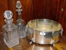 A SILVER PLATED TWIN HANDLED ICE BUCKET TOGETHER WITH TWO CUT GLASS DECANTERS