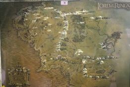 A FRAMED AND GLAZED LORD OF RINGS MAP OF MIDDLE EARTH TOGETHER WITH A PRINT