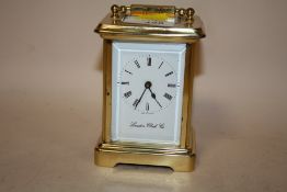A VINTAGE BRASS CARRIAGE CLOCK BY LONDON CLOCK CO., WITH KEY, A/F