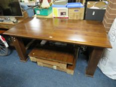 A LARGE MODERN EXTENDING DINING TABLE