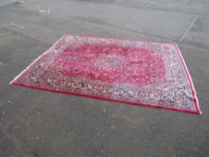A LARGE EASTERN WOOLLEN MASHAD RUG, DARK BLU, RED FLORAL PATTERN APPROX 408 X 304 CM