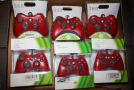 A TRAY OF BOXED GAMING CONTROLLERS