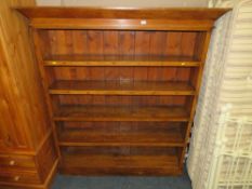A LARGE OPEN PINE AND OAK OPEN BOOKCASE H-184 W-160 CM