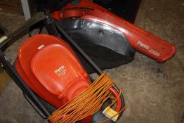 A FLYMO EASI GLIDE 300 PLUS A FLYMO GARDEN VAC 1500 PLUS