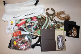 A BAG OF ASSORTED COSTUME JEWELLERY