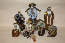 A COLLECTION OF EIGHT ORIENTAL CERAMIC FIGURES
