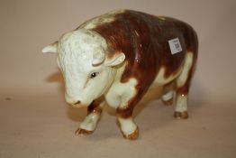 A LARGE CERAMIC BUTCHERS SHOP STYLE FIGURE OF A HEREFORD BULL, LENGTH 36 CM