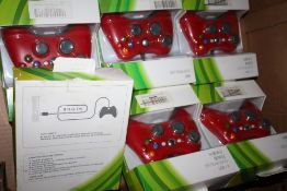 A TRAY OF BOXED GAMING CONTROLLERS