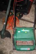 A QUALCAST CONCORDE 32 ELECTRIC LAWNMOWER TOGETHER WITH A BLACK & DECKER STRIMMER PLUS A HEDGE