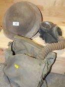 A VINTAGE MILITARY HELMET TOGETHER WITH A GAS MASK