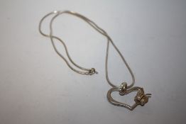 A SILVER HEART PENDANT ON CHAIN