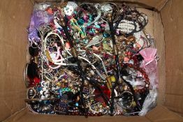 A BOX OF COSTUME JEWELLERY AND DISPLAY STANDS