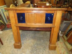 A VINTAGE FIRE SURROUND WITH BULLSEYE GLASS H-131 W-142 CM