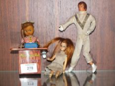 A VINTAGE TIN PLATE WIND UP 'MISS BUSY BEE THE TYPIST' TOY, TOGETHER WITH A VINTAGE EVIL KNIEVEL TOY
