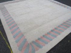 A LARGE CHINESE WOOLLEN RUG 314 X 314 CM
