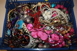 A BOX OF COSTUME JEWELLERY